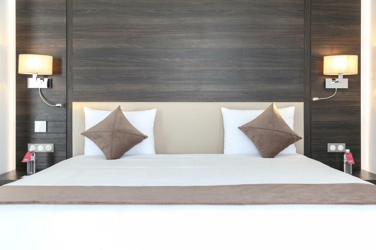 斯法克斯瑞享酒店 外观 照片 A bed